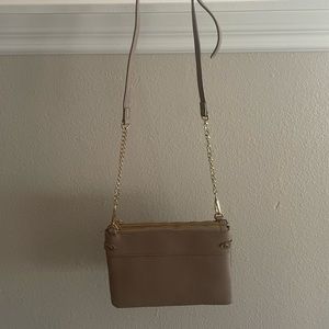 New Tan Cross Body Bag with 3 zipper pockets to keep your items organized.